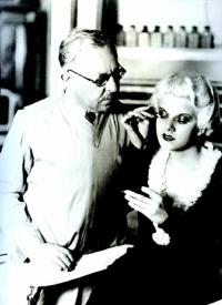 Max Factor showing Jean Harlow how to apply her makeup.