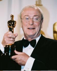 Michael Caine holds his Best Supporting Actor Oscar