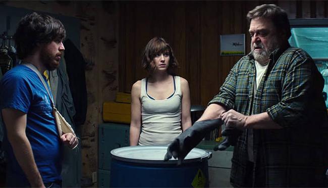 John Gallagher Jr., Mary Elizabeth Winstead, and John Goodman in 10 Cloverfield Lane. John Gallagher Jr., Mary Elizabeth Winstead, and John Goodman in 10 Cloverfield Lane.