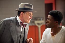 Harrison Ford as Branch Rickey and Chadwick Boseman as Jackie Robinson in 42. Harrison Ford as Branch Rickey and Chadwick Boseman as Jackie Robinson in 42.