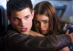Taylor Lautner and Phil Collins' daughter Lily Collins in Abduction. Taylor Lautner and Phil Collins' daughter Lily Collins in Abduction.