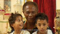 Anwar Congo and two of his grandsons in The Act of Killing.