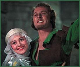Olivia de Havilland and Errol Flynn in The Adventures of Robin Hood. Olivia de Havilland and Errol Flynn in The Adventures of Robin Hood.