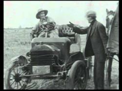 Augustus Carney buys an auto in Alkali Ike's Auto.