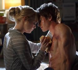 Emma Stone and Andrew Garfield get close in The Amazing Spider-man. Emma Stone and Andrew Garfield get close in The Amazing Spider-man.