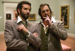 Bradley Cooper and Christian Bale in American Hustle. Bradley Cooper and Christian Bale in American Hustle.