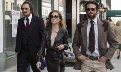 Christian Bale, Amy Adams and Bradley Cooper in American Hustle