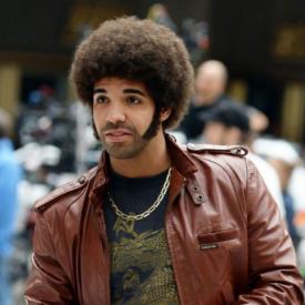 Drake as a Ron Burgundy fan in Anchorman 2: The Legend Continues.