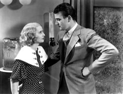Barbara Stanwyck and a baby-faced John Wayne in Baby Face. Barbara Stanwyck and a baby-faced John Wayne in Baby Face.