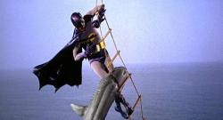 Adam West battles a shark as Batman,but luckily has some Bat-Shark Repellent available.