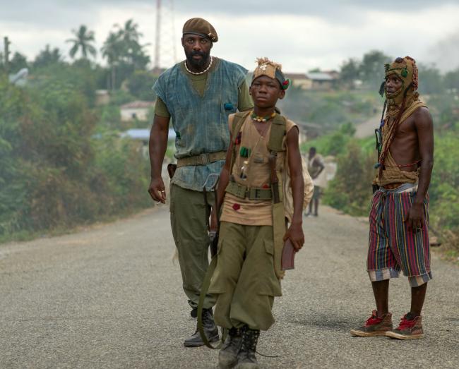 Idris Elba and Abraham Attah in Beasts of No Nation. Idris Elba and Abraham Attah in Beasts of No Nation.