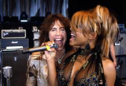 Steven Tyler and Christina Milian in Be Cool. Steven Tyler and Christina Milian in Be Cool.