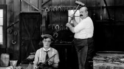 Buster Keaton and Joe Roberts in The Blacksmith.