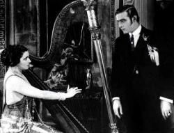 Nita Naldi seduces Rudolph Valentino in Blood and Sand