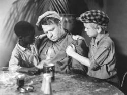 Jesse Scott, Wallace Beery, and Jackie Cooper in The Champ.