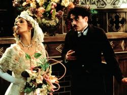 Marisa Tomei and Robert Downey Jr. as Mabel Normand and Charles Chaplin.