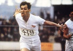 Ben Cross, as Harold Abrahams, crosses the finish line in Chariots of Fire.