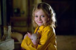 Dakota Fanning with Wilbur in Charlotte's Web.