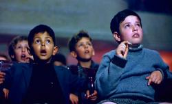 Salvatore discovers the magic of the movies in Cinema Paradiso.