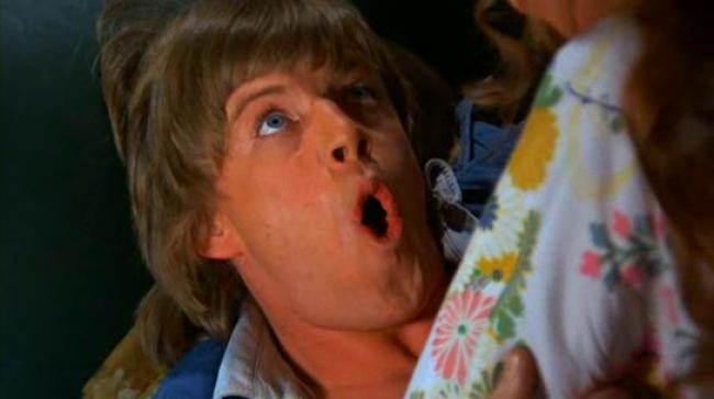 Robin Askwith as Timothy Lea, losing his virginity to a garter belt in Confessions of a Window Cleaner
