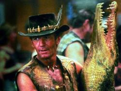 Paul Hogan makes his entrance as Crocodile Dundee  with one of his namesake mates.