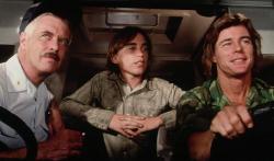 George Peppard, Jackie Earle Haley and Jan-Michael Vincent drive down Damnation Alley.