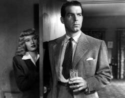 Barbara Stanwyck and Fred MacMurray in Double Indemnity. Barbara Stanwyck and Fred MacMurray in Double Indemnity.