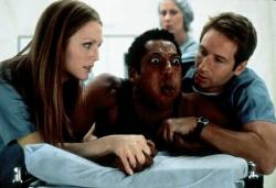 Julianne Moore, Orlando Jones and David Duchovny in Evolution. Julianne Moore, Orlando Jones and David Duchovny in Evolution.