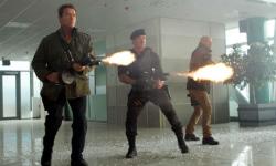 Schwarzenegger, Stallone and Willis with guns blazing in The Expendables 2.