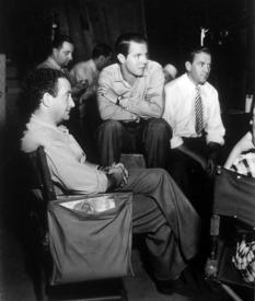 Director Alfred Santell and Louis Hayward on the set of A Feather in Her Hat.