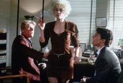 Gary Busey, Holly Hunter, and Tom Cruise in The Firm.