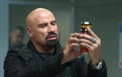 John Travolta is badass old-school in From Paris with Love. John Travolta is badass old-school in From Paris with Love.