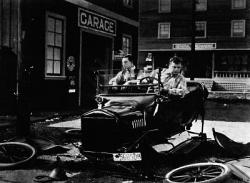 Buster Keaton and Roscoe Arbuckle in The Garage. Buster Keaton and Roscoe Arbuckle in The Garage.