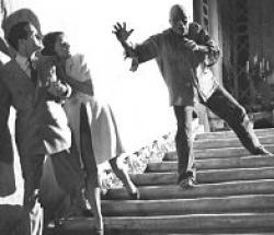 Bob Hope and Paulette Goddard run from Noble Johnson as The Zombie in The Ghost Breakers.