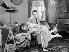 Harold acts like a caveman and spanks a flapper. Harold acts like a caveman and spanks a flapper.