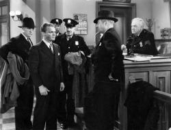 James Cagney gets roughed up and arrested in Great Guy.