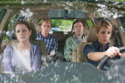 The husbands riding in the back seat like scolded children. The husbands riding in the back seat like scolded children.