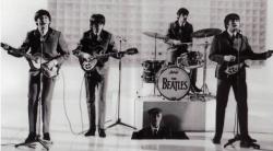 Paul, George, Ringo and John (and Paul's very clean grandfather) in A Hard Day's Night.