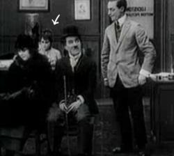Yep, That is Gloria Swanson sitting behind Charles Chaplin in His New Job Yep, That is Gloria Swanson sitting behind Charles Chaplin in His New Job