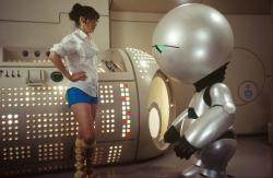 Zooey Deschanel and Marvin the Paranoid Android in The Hitchhiker's Guide to the Galaxy.