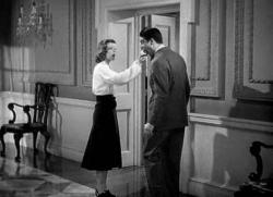 Katharine Hepburn offers Cary Grant a bite of her apple in Holiday. Katharine Hepburn offers Cary Grant a bite of her apple in Holiday.