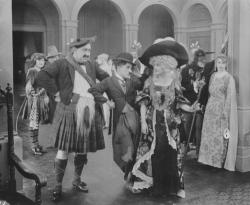 Mack Swain, Charlie Chaplin, and Edna Purviance in The Idle Class.