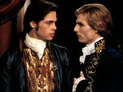 Brad Pitt and Tom Cruise, as Louis and Lestat, gaze deeply into each other's eyes in Interview with a Vampire.