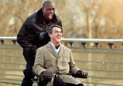 Omar Sy pushes Francois Cluzet in The Intouchables. Omar Sy pushes Francois Cluzet in The Intouchables.