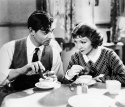 Clark Gable and Claudette Colbert in It Happened One Night. Clark Gable and Claudette Colbert in It Happened One Night.