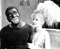Al Jolson in blackface with May McAvoy in The Jazz Singer.