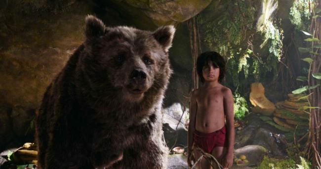Baloo and Mowgli, played by Neel Sethi, in The Jungle Bopok Baloo and Mowgli, played by Neel Sethi, in The Jungle Bopok