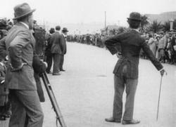 Charles Chaplin being a nuisance as the Tramp in Kid Auto Races at Venice