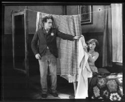 Harold Lloyd happens one night to offer shelter to Jobyna Ralston in The Kid Brother. Harold Lloyd happens one night to offer shelter to Jobyna Ralston in The Kid Brother.
