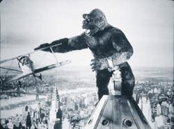 King Kong battles biplanes atop the Empire State Building in the definitive 1933 classic King Kong.